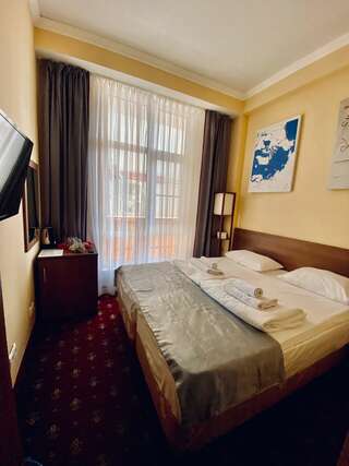 Отель Чкалов Адлер Стандартный двухместный номер с 1 кроватью или 2 отдельными кроватями-1